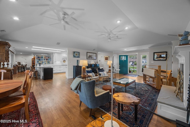 110 Mariners Ct, New Bern, NC 28562 - living room with recessed lighting, ceiling fan, vaulted ceiling, and light wood-type flooring