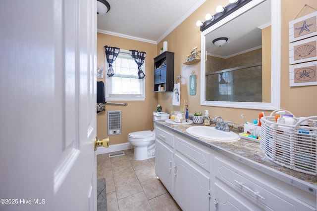800 S Vance St, Fremont, NC 27830 - bathroom with vanity, a shower with shower door, tile patterned floors, crown molding, and heating unit