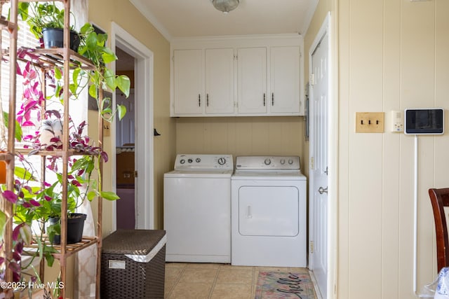 800 S Vance St, Fremont, NC 27830 - washroom featuring washing machine and clothes dryer, cabinet space, and light tile patterned floors