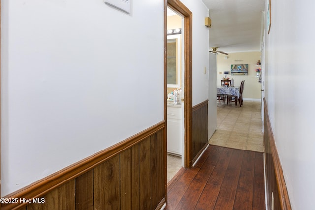 800 S Vance St, Fremont, NC 27830 - corridor featuring wainscoting and dark wood-style flooring