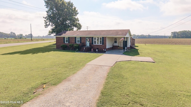 800 S Vance St, Fremont, NC 27830 - ranch-style home with driveway, a front lawn, brick siding, and a carport