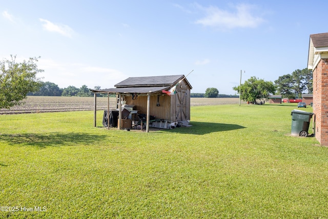 800 S Vance St, Fremont, NC 27830 - view of grassy yard with a shed and a view of rural / pastoral area