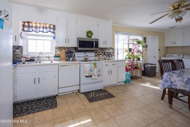 800 S Vance St, Fremont, NC 27830 - kitchen with white appliances, tasteful backsplash, washer / dryer, light countertops, and ornamental molding