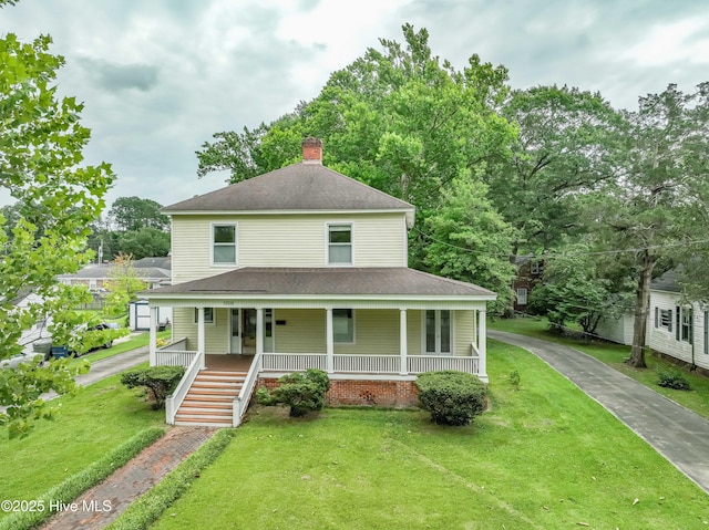 1305 N Market St, Washington, NC 27889 - view of front of property with a porch, a front lawn, a chimney, and roof with shingles