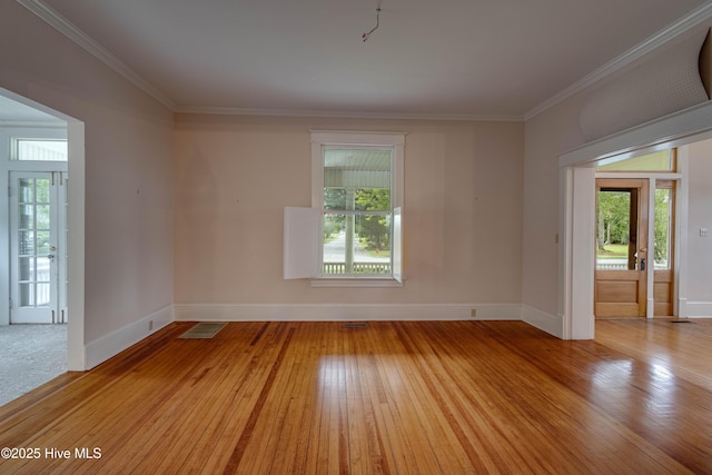 1305 N Market St, Washington, NC 27889 - unfurnished room featuring ornamental molding and light wood finished floors