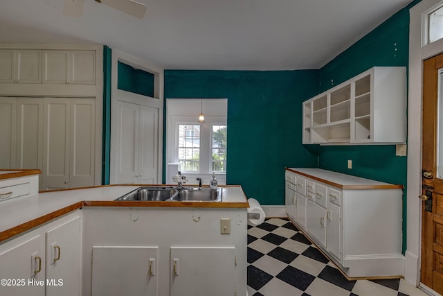 1305 N Market St, Washington, NC 27889 - kitchen with light floors, white cabinets, light countertops, and open shelves