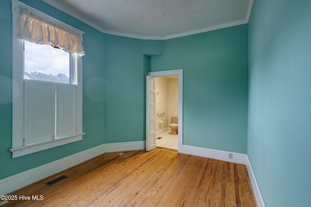 1305 N Market St, Washington, NC 27889 - unfurnished room with light wood finished floors and crown molding
