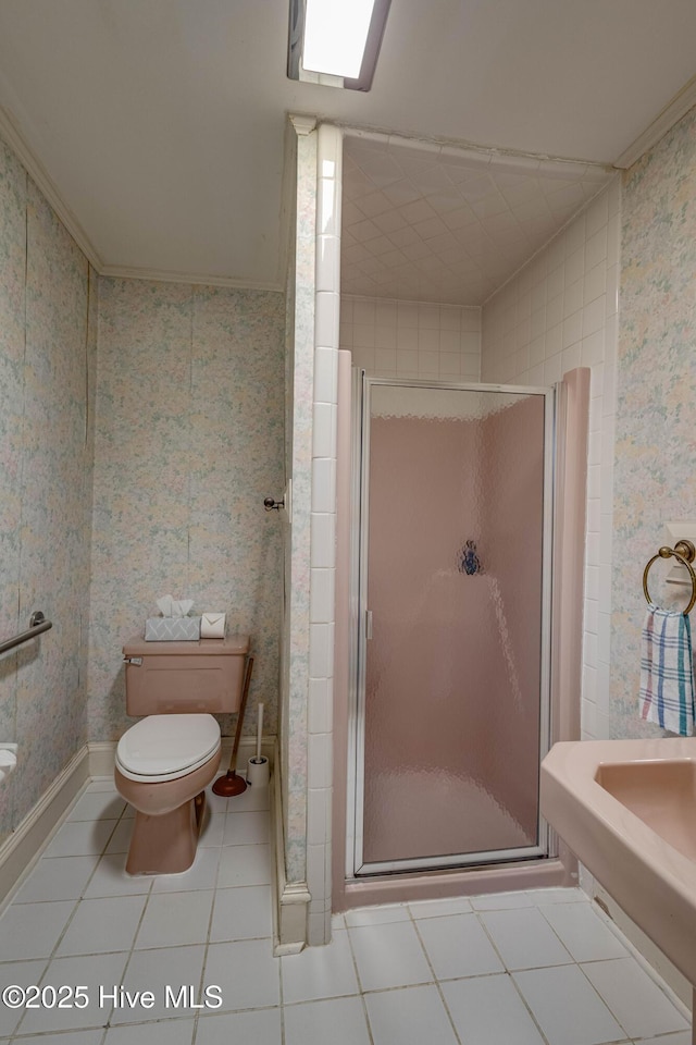 1305 N Market St, Washington, NC 27889 - bathroom featuring a stall shower, tile patterned flooring, and wallpapered walls