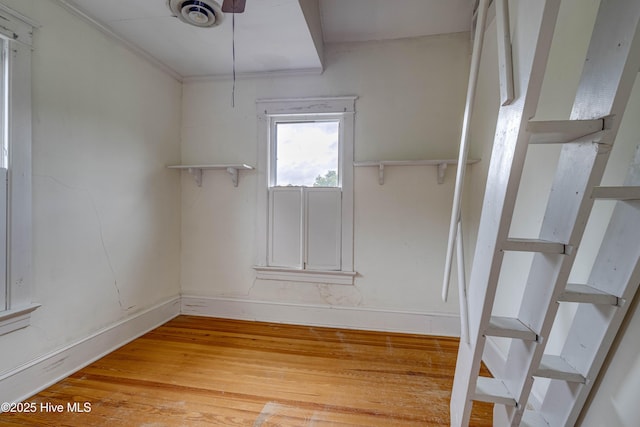 1305 N Market St, Washington, NC 27889 - empty room featuring light wood-style flooring and stairs