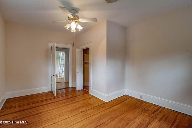 1305 N Market St, Washington, NC 27889 - unfurnished bedroom featuring light wood-type flooring, a closet, and a ceiling fan