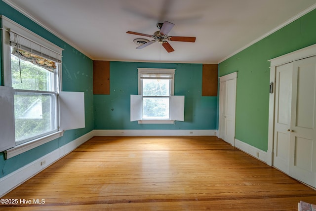 1305 N Market St, Washington, NC 27889 - empty room with light wood-style flooring, crown molding, and ceiling fan