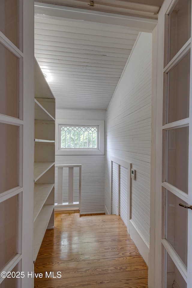 1305 N Market St, Washington, NC 27889 - hall featuring lofted ceiling, wood finished floors, and wood walls