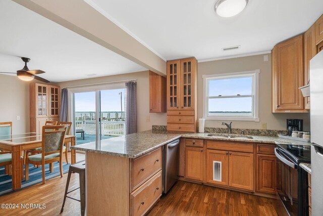 1086 Salter Path Rd, Salter Path, NC 28512 - kitchen with black / electric stove, a peninsula, stainless steel dishwasher, plenty of natural light, and crown molding