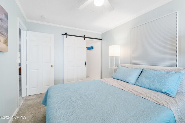 1086 Salter Path Rd, Salter Path, NC 28512 - bedroom with a barn door, light colored carpet, crown molding, and a ceiling fan