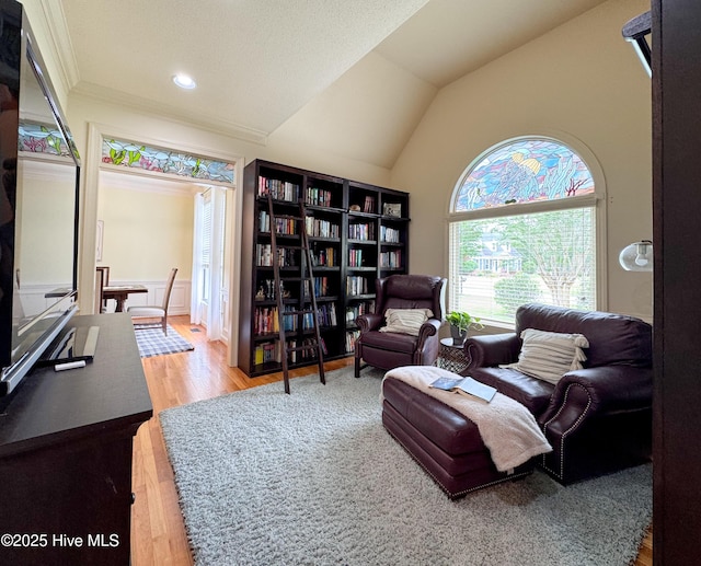 4109 Devonshire Ln, Wilmington, NC 28409 - living area with wood finished floors, vaulted ceiling, and ornamental molding