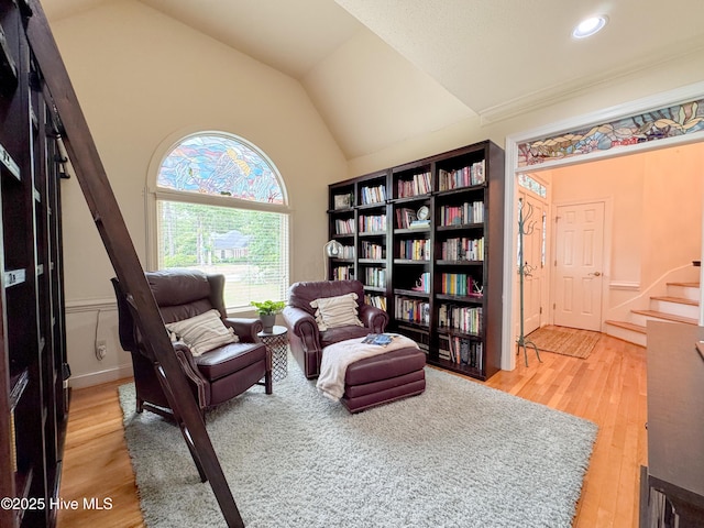 4109 Devonshire Ln, Wilmington, NC 28409 - sitting room with light wood-type flooring, vaulted ceiling, stairway, and recessed lighting
