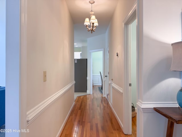 4109 Devonshire Ln, Wilmington, NC 28409 - hall featuring a chandelier and light wood-type flooring