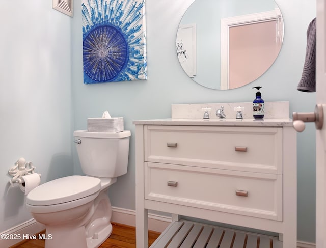 4109 Devonshire Ln, Wilmington, NC 28409 - half bathroom featuring vanity and wood finished floors