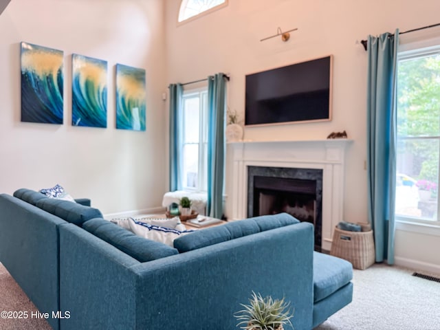 4109 Devonshire Ln, Wilmington, NC 28409 - carpeted living area with a high end fireplace and plenty of natural light