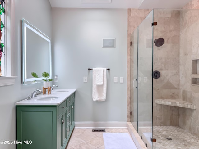 4109 Devonshire Ln, Wilmington, NC 28409 - full bath featuring double vanity, a stall shower, and tile patterned flooring