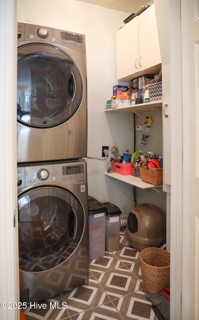 4109 Devonshire Ln, Wilmington, NC 28409 - washroom with stacked washing machine and dryer and cabinet space