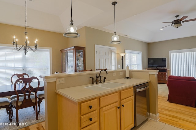8975 Smithfield Dr NW Apt 2, Calabash, NC 28467 - kitchen featuring dishwasher, open floor plan, light countertops, a chandelier, and a center island with sink