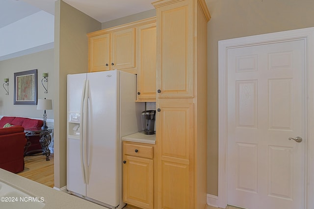 8975 Smithfield Dr NW Apt 2, Calabash, NC 28467 - kitchen featuring white refrigerator with ice dispenser, light brown cabinets, light countertops, and light wood finished floors
