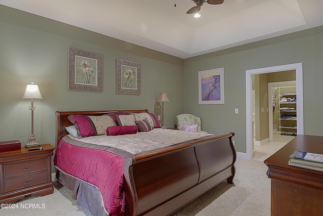 8975 Smithfield Dr NW Apt 2, Calabash, NC 28467 - bedroom featuring a tray ceiling, light carpet, and a ceiling fan