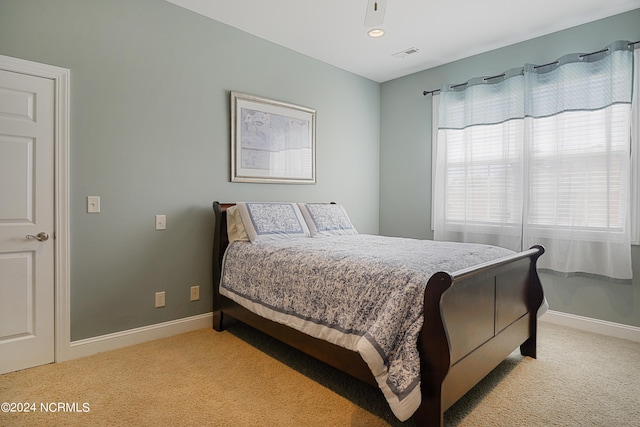 8975 Smithfield Dr NW Apt 2, Calabash, NC 28467 - bedroom featuring light carpet and baseboards