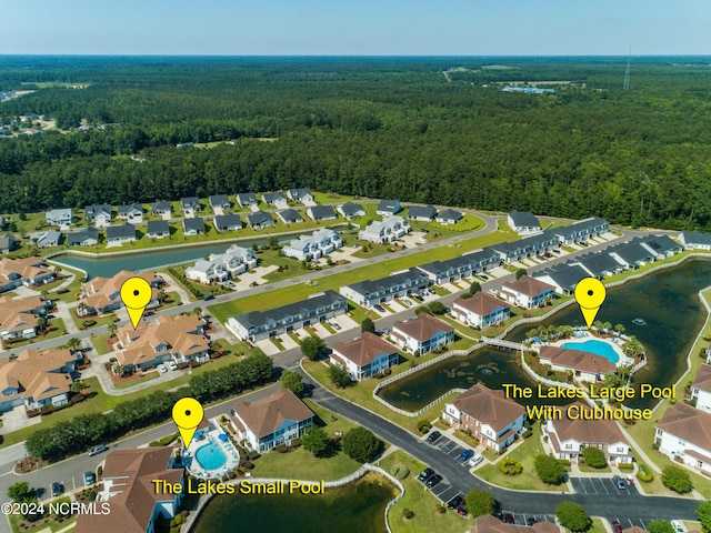 8975 Smithfield Dr NW Apt 2, Calabash, NC 28467 - aerial overview of property's location featuring a forest and nearby suburban area