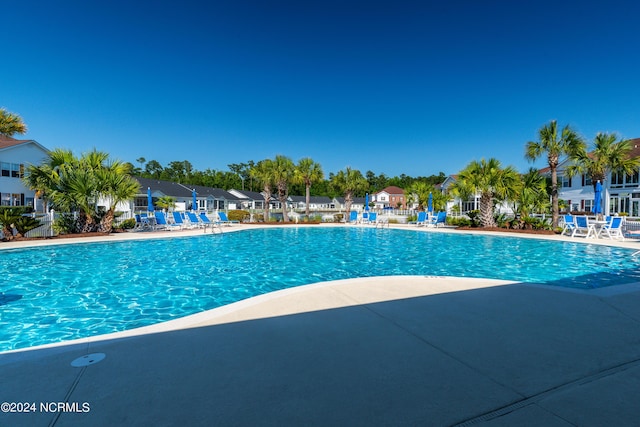 8975 Smithfield Dr NW Apt 2, Calabash, NC 28467 - community pool with a patio and a residential view