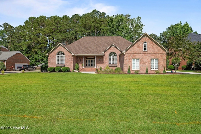 104 Chatham Pass, Trent Woods, NC 28562 - ranch-style house with brick siding, a front lawn, and french doors