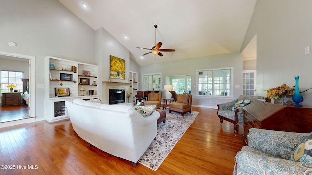 104 Chatham Pass, Trent Woods, NC 28562 - living room with a glass covered fireplace, high vaulted ceiling, light wood-type flooring, plenty of natural light, and ceiling fan