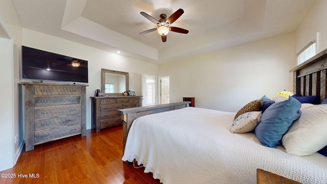 104 Chatham Pass, Trent Woods, NC 28562 - bedroom featuring a raised ceiling, wood finished floors, and ceiling fan