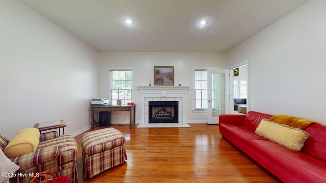 104 Chatham Pass, Trent Woods, NC 28562 - living room with light wood-style floors, a tiled fireplace, and recessed lighting
