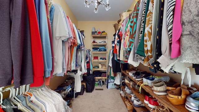 104 Chatham Pass, Trent Woods, NC 28562 - walk in closet featuring carpet flooring and a chandelier