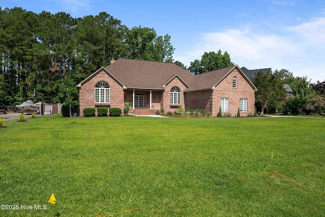 104 Chatham Pass, Trent Woods, NC 28562 - ranch-style home with brick siding, a front lawn, and a shingled roof