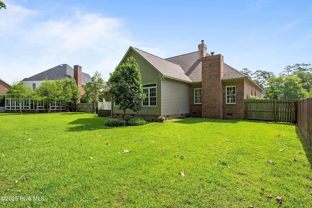 104 Chatham Pass, Trent Woods, NC 28562 - back of property featuring crawl space, a fenced backyard, and a chimney