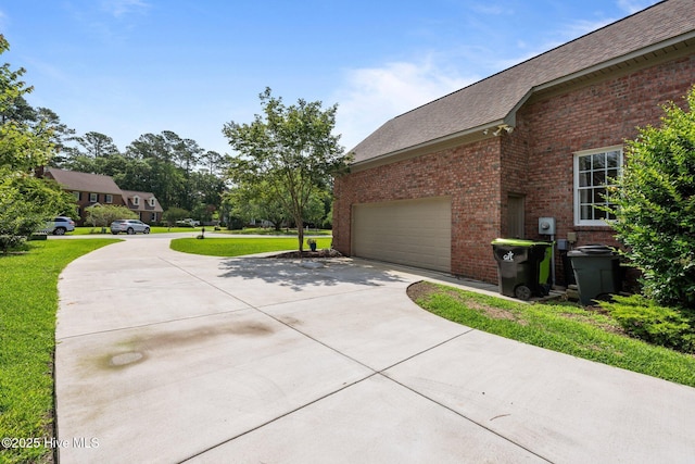 104 Chatham Pass, Trent Woods, NC 28562 - view of side of home featuring driveway, brick siding, roof with shingles, a lawn, and a garage