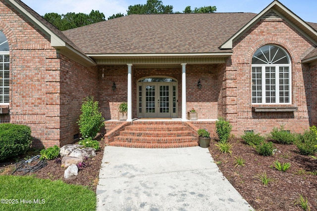 104 Chatham Pass, Trent Woods, NC 28562 - entrance to property featuring brick siding, french doors, and a shingled roof