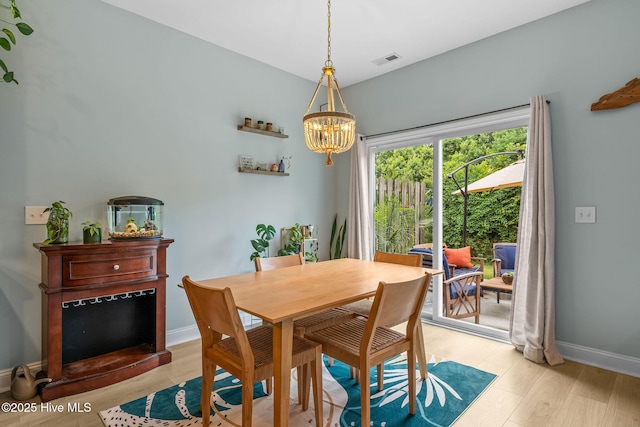 1571 Grey Cliff Run, Wilmington, NC 28405 - dining room with a chandelier and light wood finished floors