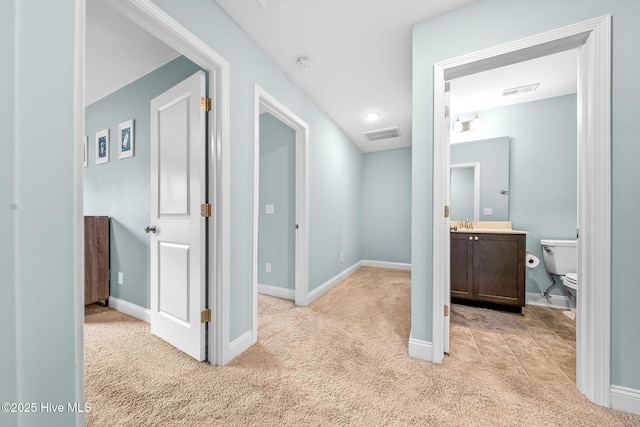 1571 Grey Cliff Run, Wilmington, NC 28405 - hallway featuring light carpet and baseboards