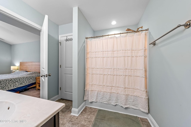 1571 Grey Cliff Run, Wilmington, NC 28405 - full bath featuring vanity, ensuite bath, shower / bath combo with shower curtain, and tile patterned flooring