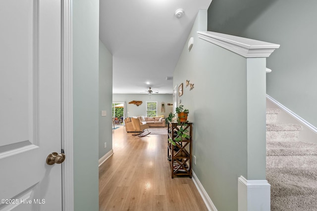 1571 Grey Cliff Run, Wilmington, NC 28405 - hallway featuring light wood-type flooring and stairs