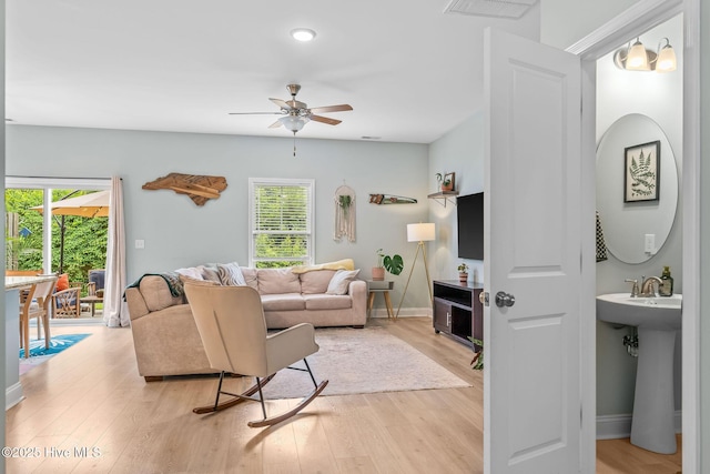 1571 Grey Cliff Run, Wilmington, NC 28405 - living room with healthy amount of natural light, a ceiling fan, light wood-style floors, and recessed lighting