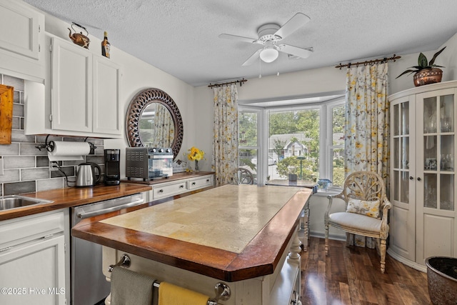 600 N 35th St Unit 201, Morehead City, NC 28557 - kitchen featuring butcher block counters, ceiling fan, a textured ceiling, dishwasher, and decorative backsplash