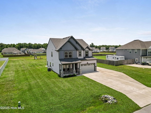 132 Mill Run, South Mills, NC 27976 - view of front of house with board and batten siding, a garage, concrete driveway, covered porch, and a residential view