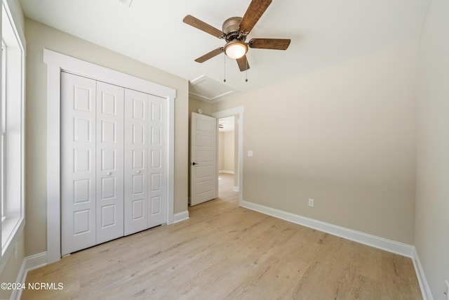 72 S Greensboro Rd, Southport, NC 28461 - unfurnished bedroom with light wood-style floors, a closet, and ceiling fan