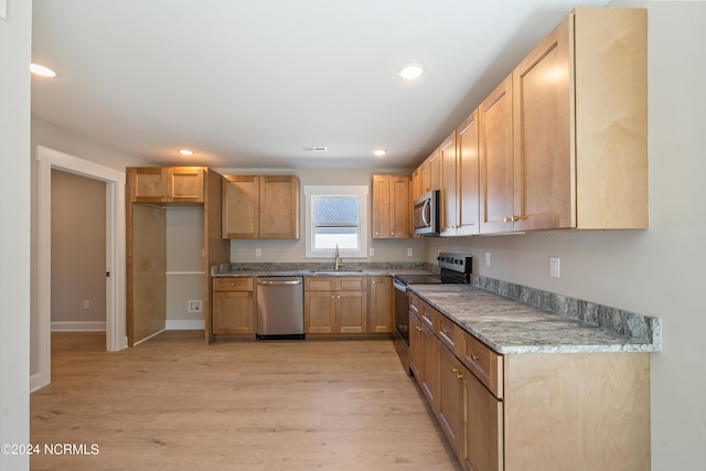 72 S Greensboro Rd, Southport, NC 28461 - kitchen with appliances with stainless steel finishes, light wood-style flooring, and recessed lighting