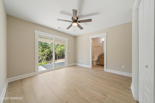 72 S Greensboro Rd, Southport, NC 28461 - unfurnished bedroom with access to exterior, light wood finished floors, ensuite bathroom, and a ceiling fan